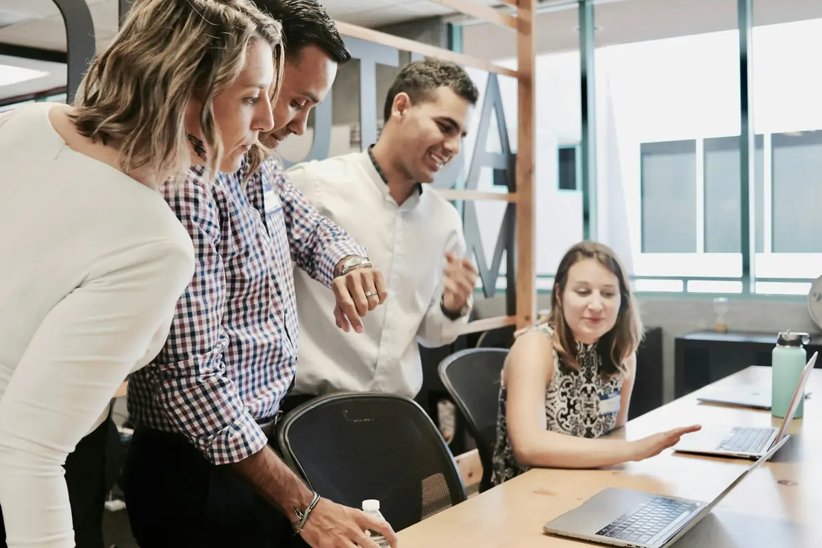 A team lead handing over work to a team member